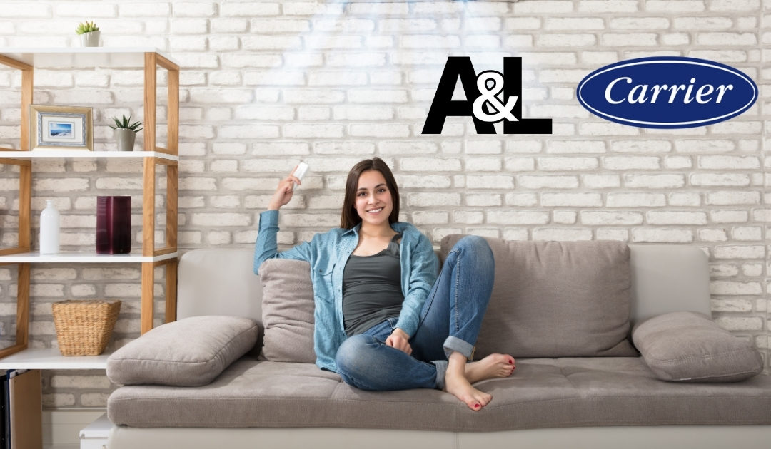 girl sitting on couch with air conditioning remote